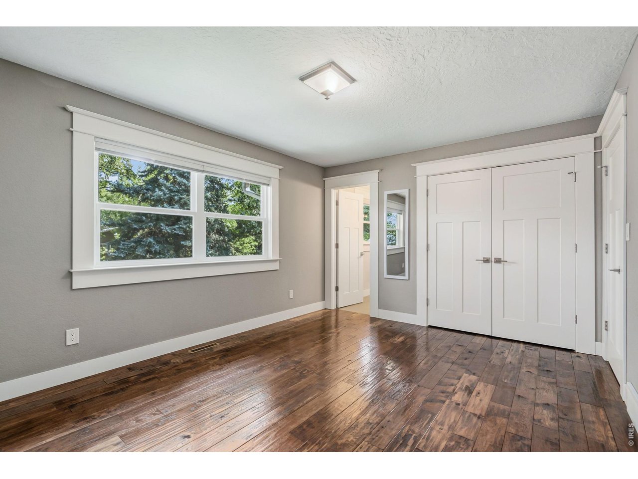 Property Photo 19 Primary bedroom with engineered hardwood flooring