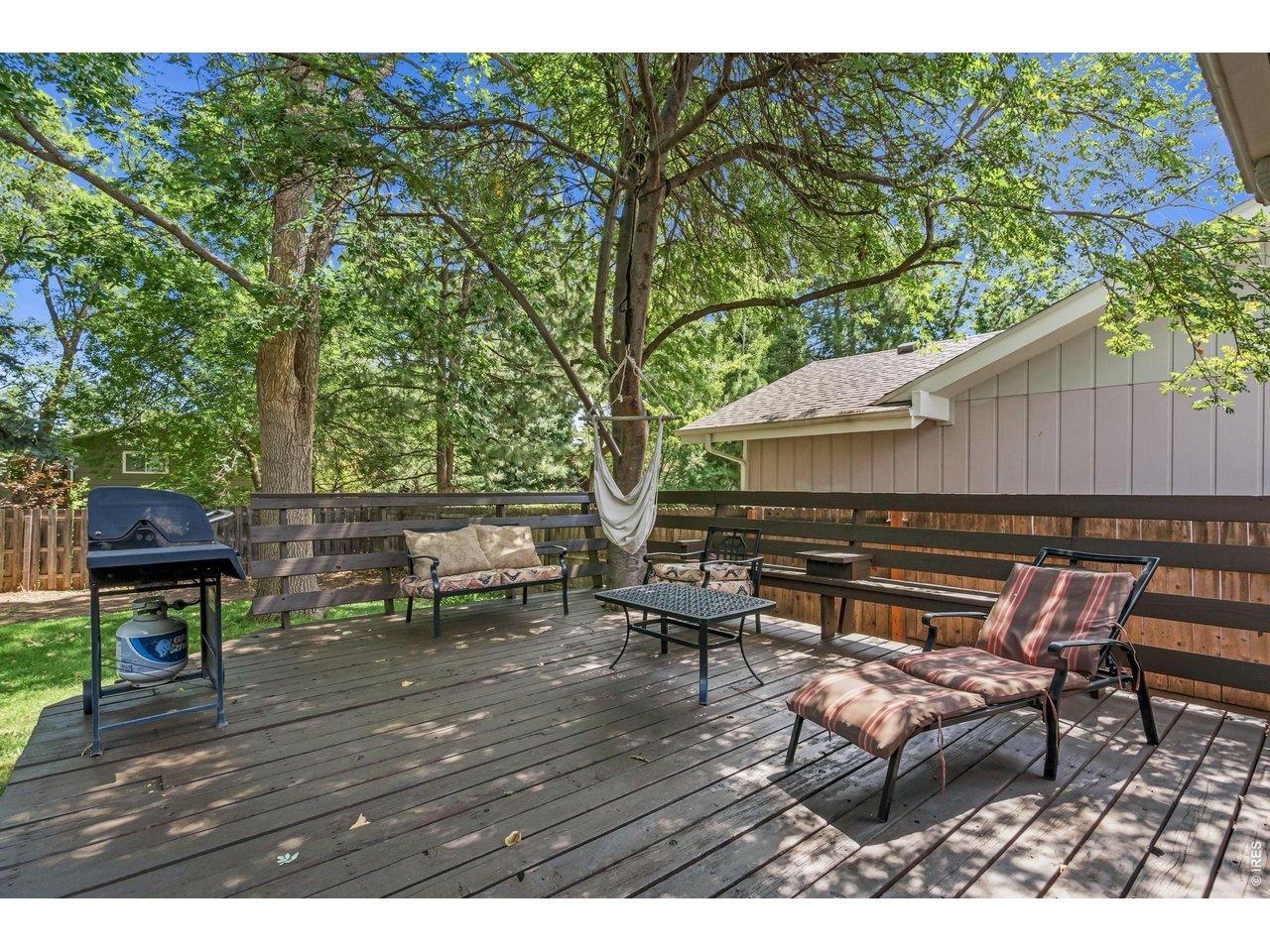 Property Photo 31 Expansive deck overlooking wooded backyard