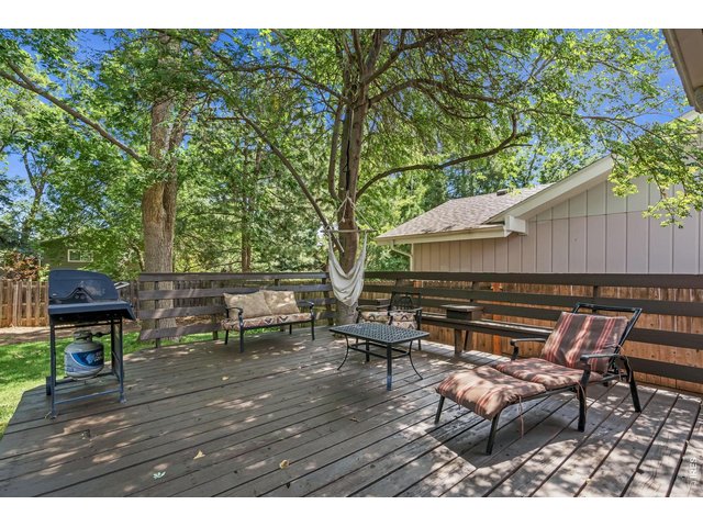 Property Photo 31 Expansive deck overlooking wooded backyard