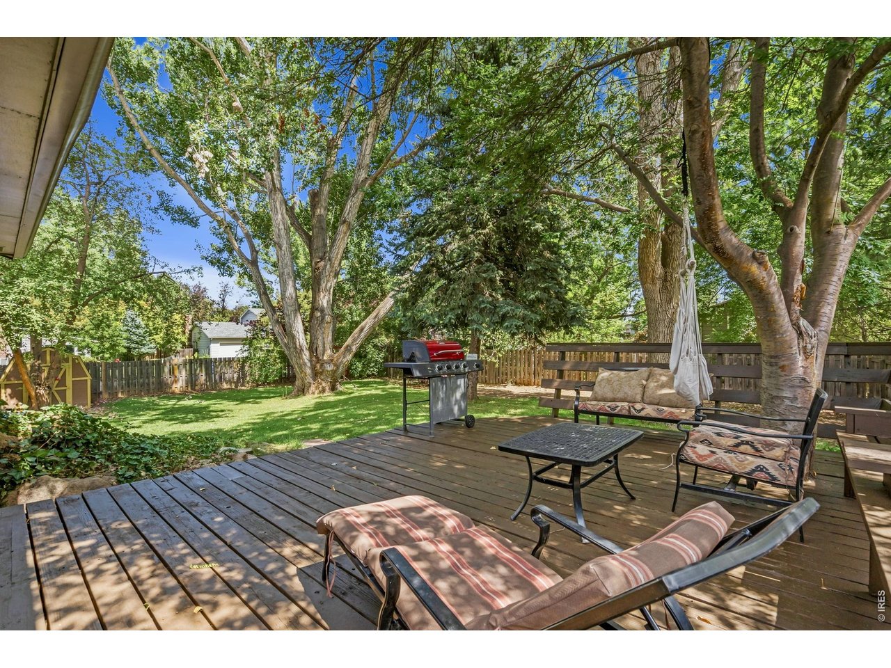 Property Photo 32 Expansive deck overlooking wooded backyard