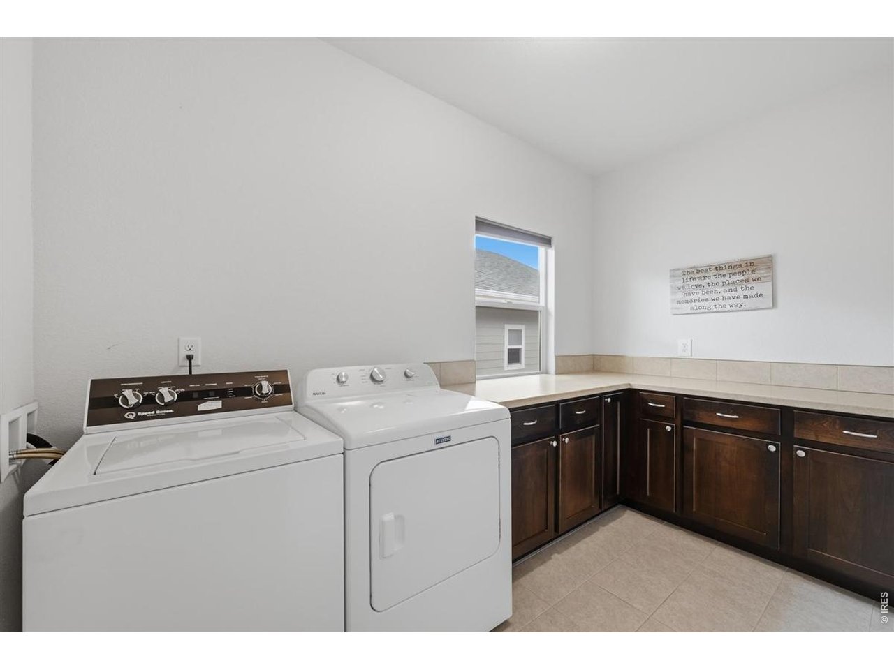 Property Photo 6 Large laundry room with ample cabinet and counter space