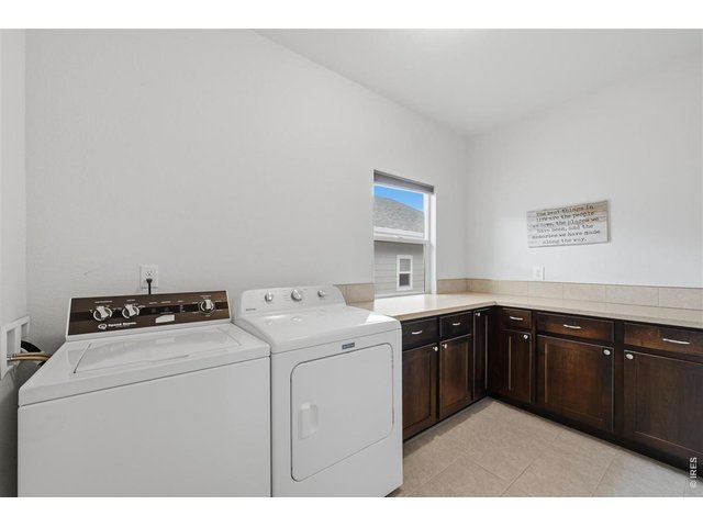Property Photo 6 Large laundry room with ample cabinet and counter space