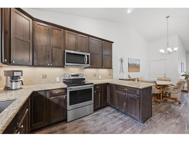 Property Photo 17 Kitchen and stainless steel appliances