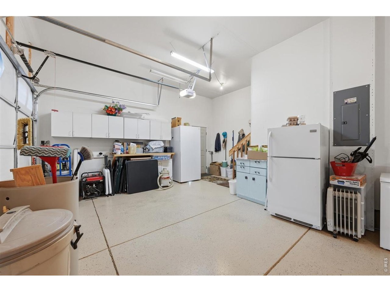 Property Photo 19 Oversized 3 car garage with epoxy floors and built in storage
