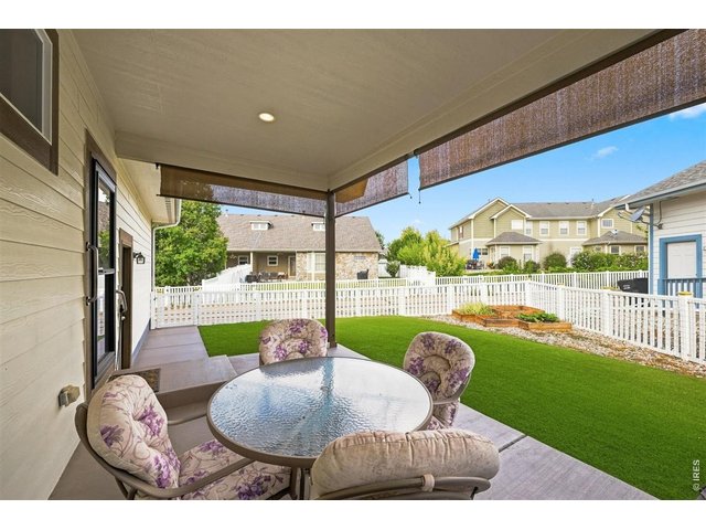Property Photo 23 Covered back porch and low maintenance backyard