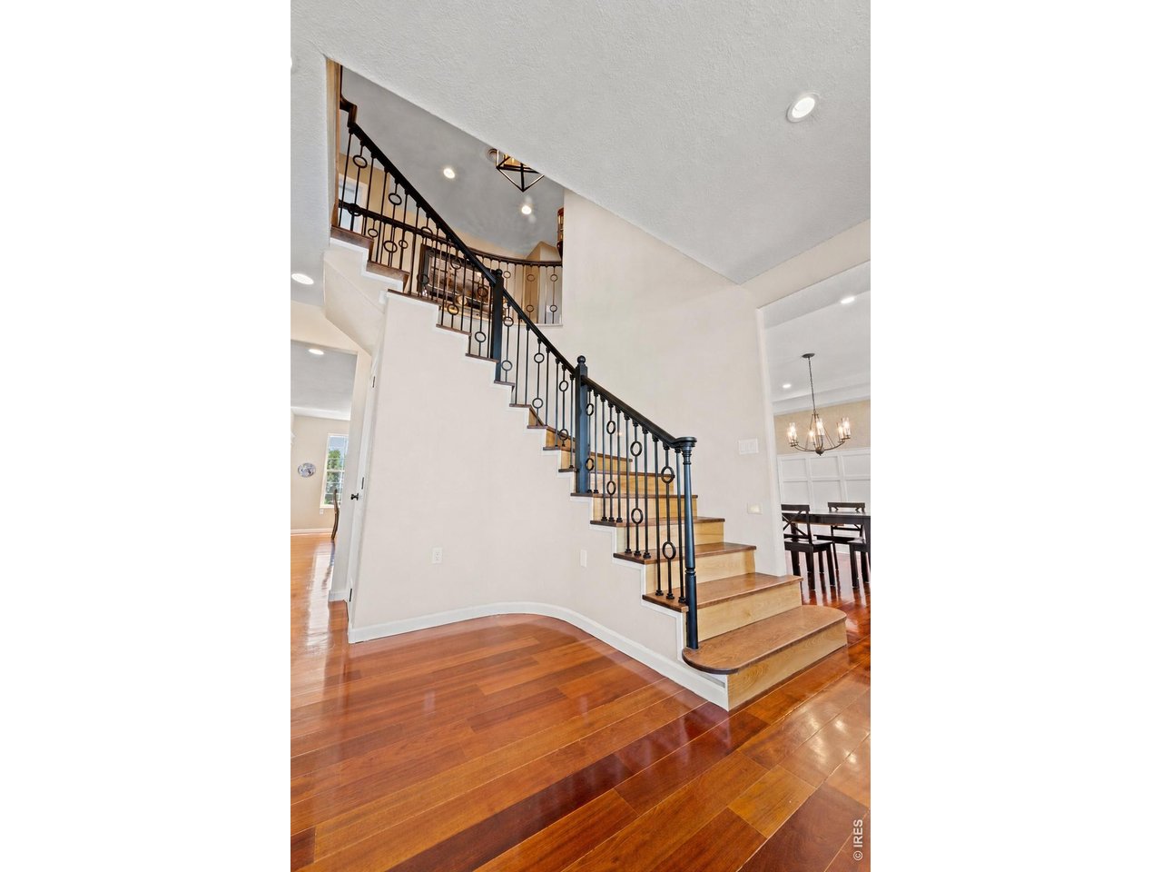 Property Photo 20 Virtually renovated and staged. Breath-taking staircase!