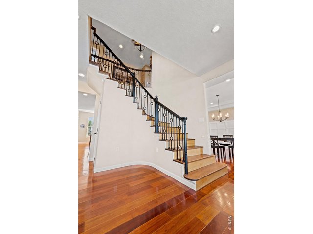 Property Photo 20 Virtually renovated and staged. Breath-taking staircase!
