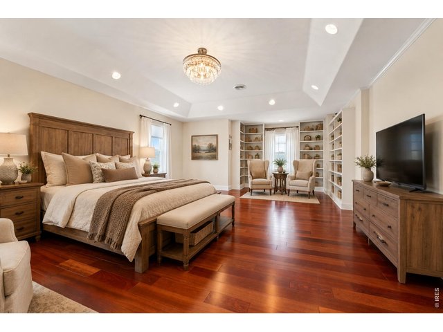 Property Photo 23 Virtually painted and staged. Master bedroom with built in book shelves!