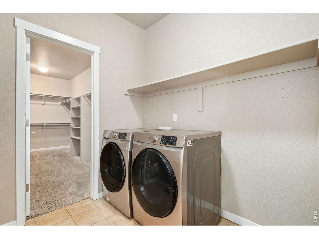 Property Photo 22 Primary Closet with Walk Thru to Laundry Room