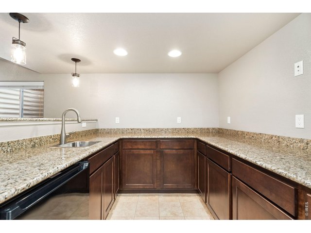 Property Photo 28 Granite Countertops, Sink and Mini Fridge
