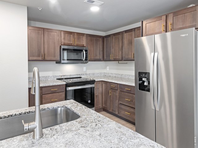 Property Photo 5 Kitchen with stainless steel appliances