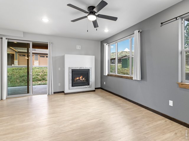 Property Photo 14 Living area with gas fireplace and patio