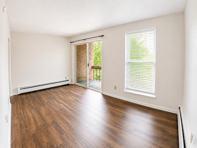Property Photo 4 Primary Bedroom w/ Balcony