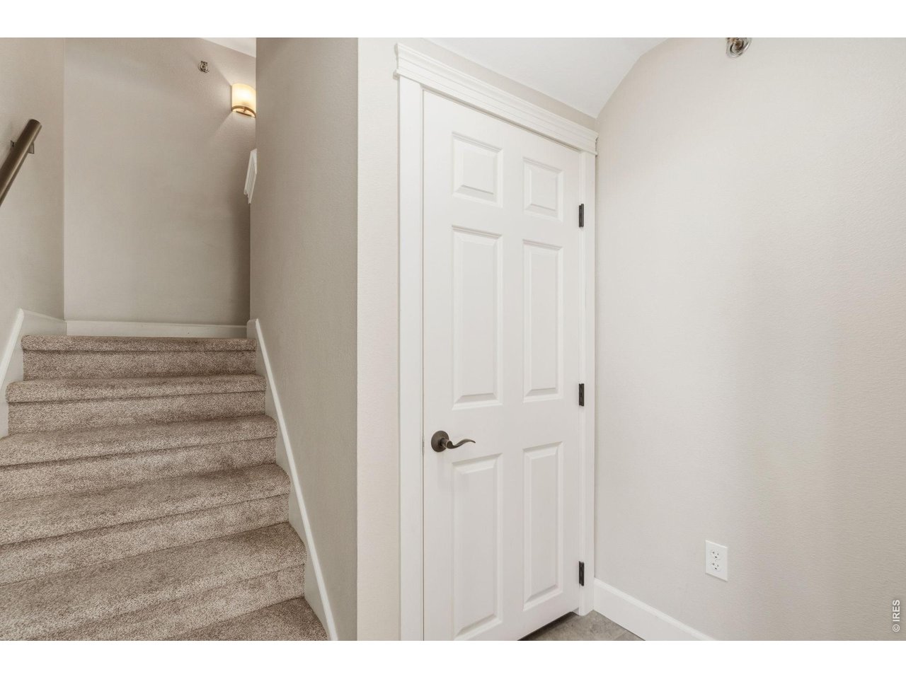 Property Photo 4 Ground level entry with spacious coat closet. Stairs up to the main level.