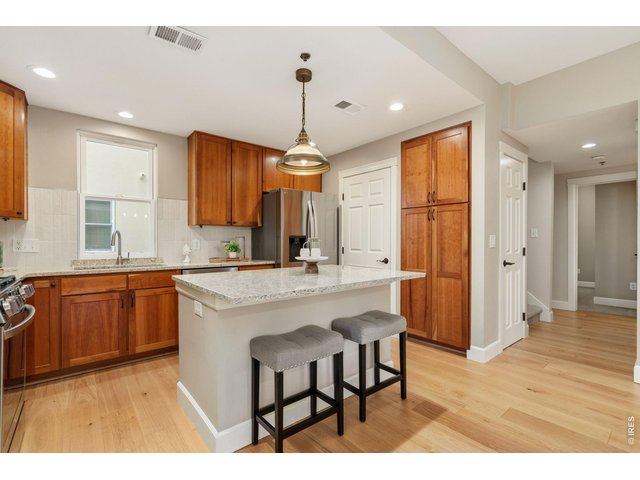Property Photo 12 Plenty of work space at the granite counters and island along with a dedicated pantry.