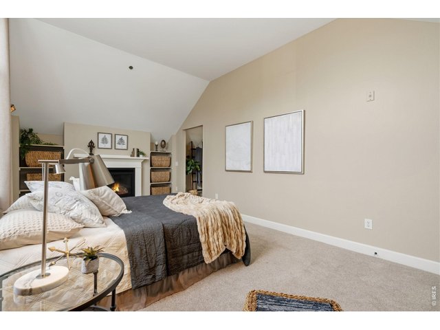 Property Photo 23 A cozy, gas fireplace adds warmth and ambiance to the primary ensuite.