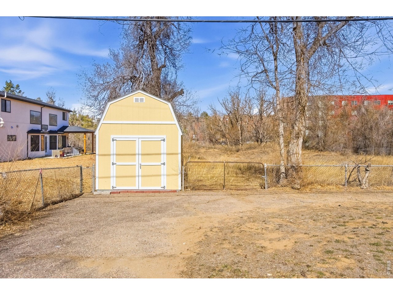 Property Photo 6 Detached Shed included! Chain link fence in place enclosing the front portion of the property making it great for your pets!