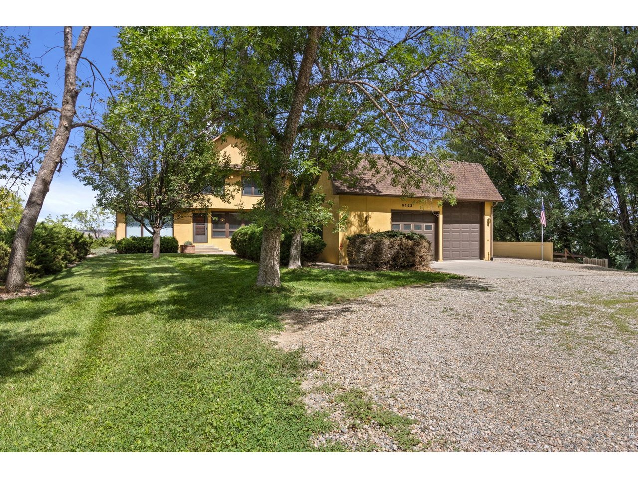 Property Photo 2 Grand home with circular drive, oversized garage with RV bay, and lots of shade trees