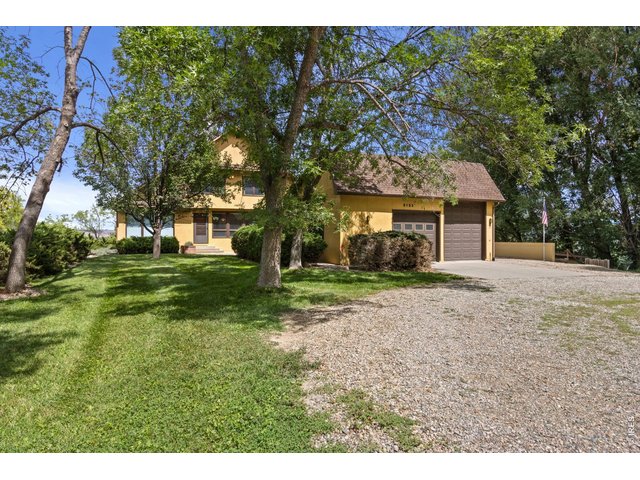 Property Photo 2 Grand home with circular drive, oversized garage with RV bay, and lots of shade trees