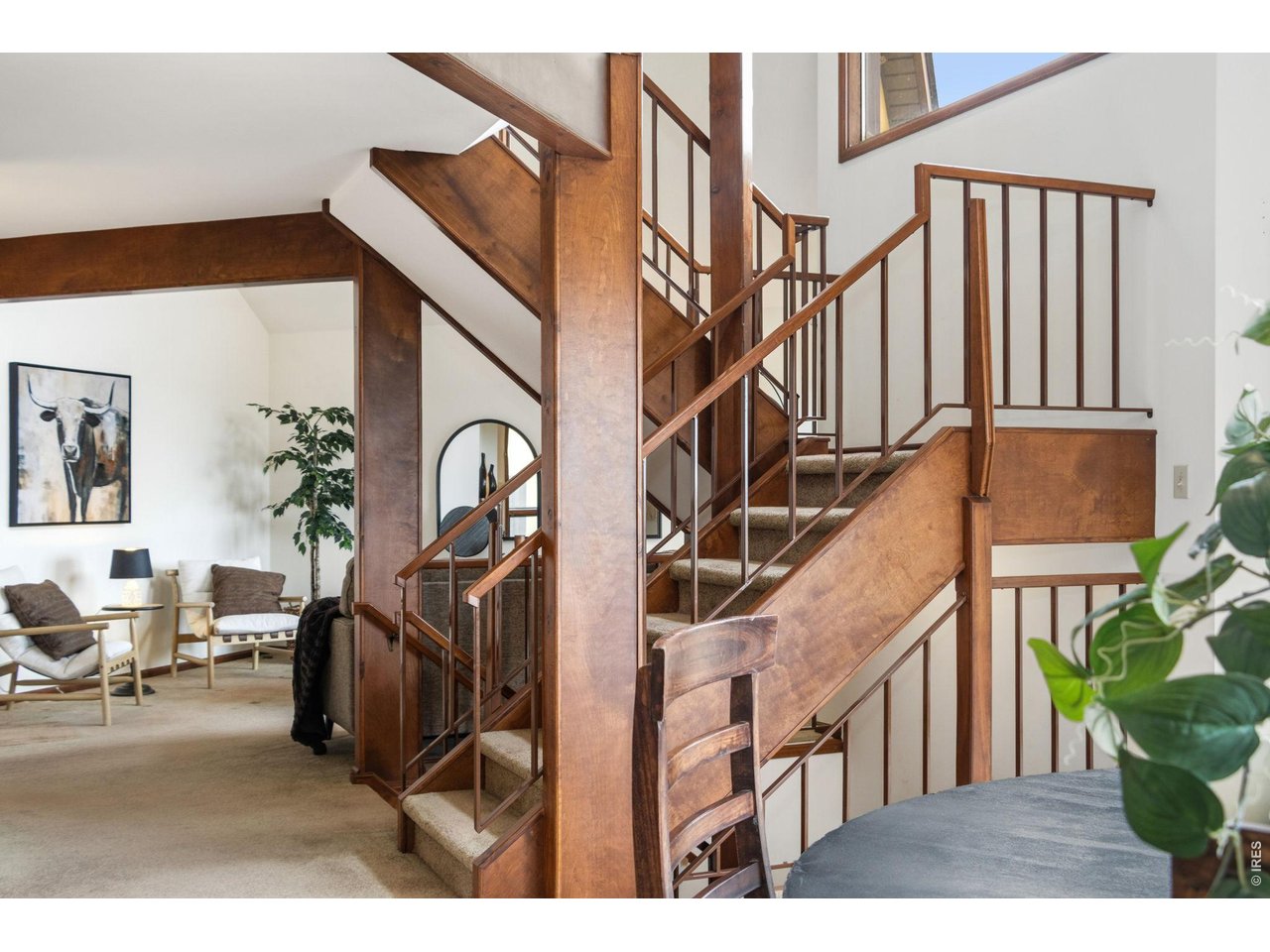 Property Photo 13 Dining room featuring an open-concept view of the grand staircase and living room.