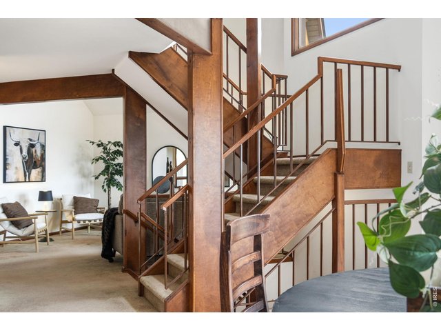 Property Photo 13 Dining room featuring an open-concept view of the grand staircase and living room.