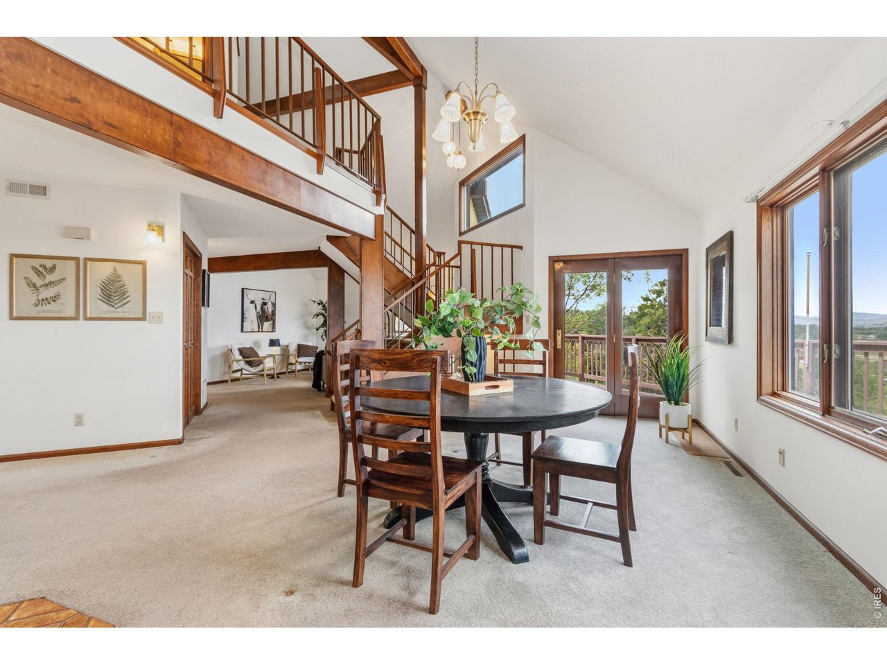 Property Photo 15 Dining room with direct access to the wrap-around deck, perfect for indoor-outdoor entertaining.