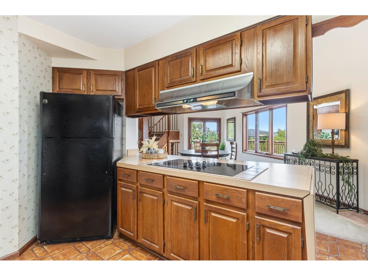 Property Photo 20 The kitchen flows right into the dining area, making it a great spot for everyday meals or hosting dinner parties.