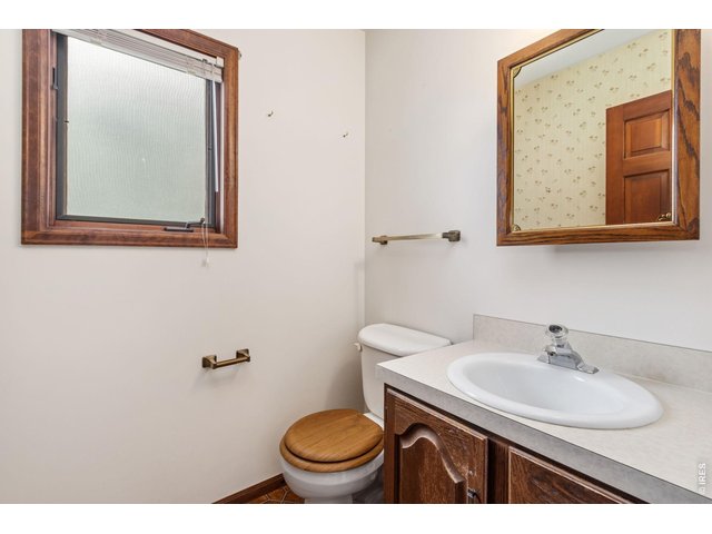 Property Photo 23 Powder bath conveniently tucked away on the main level for guests.