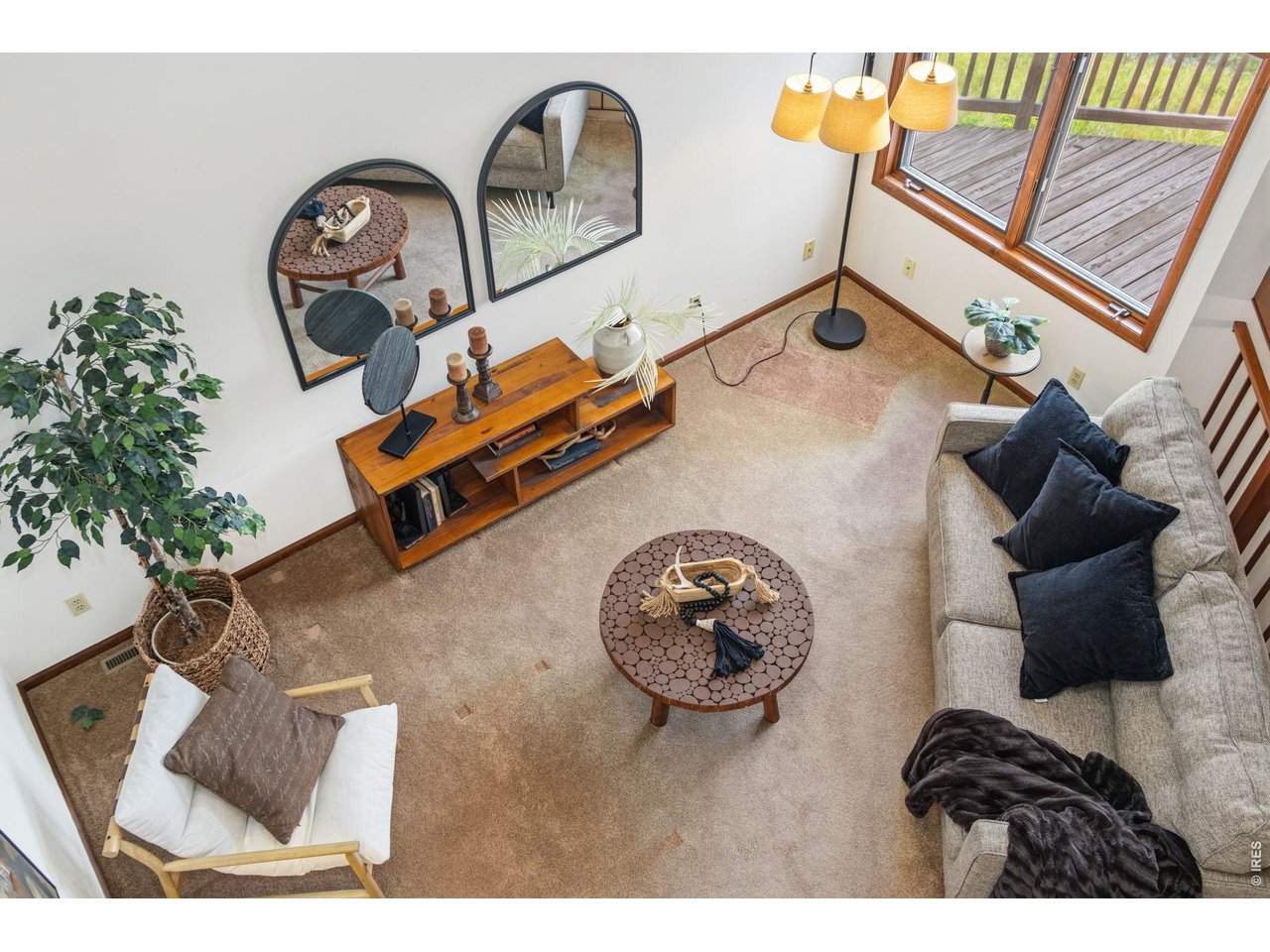 Property Photo 10 Loft view overlooking the living room, highlighting the open floor plan and soaring ceilings.