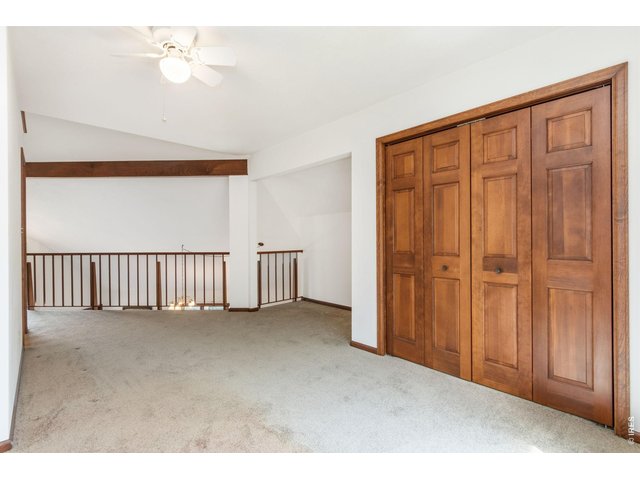 Property Photo 29 Open loft featuring a large closet and charming, unique architectural nooks.