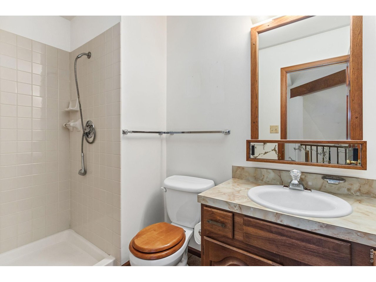 Property Photo 31 Upstairs bathroom featuring a shower, providing convenient access for both the loft bedroom and the open living area.