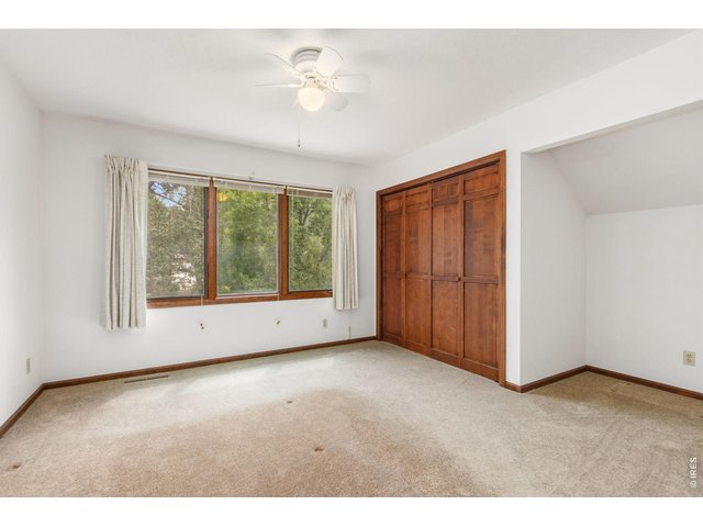 Property Photo 27 Upstairs loft bedroom, fully enclosed for privacy with large closet and views to the front yard
