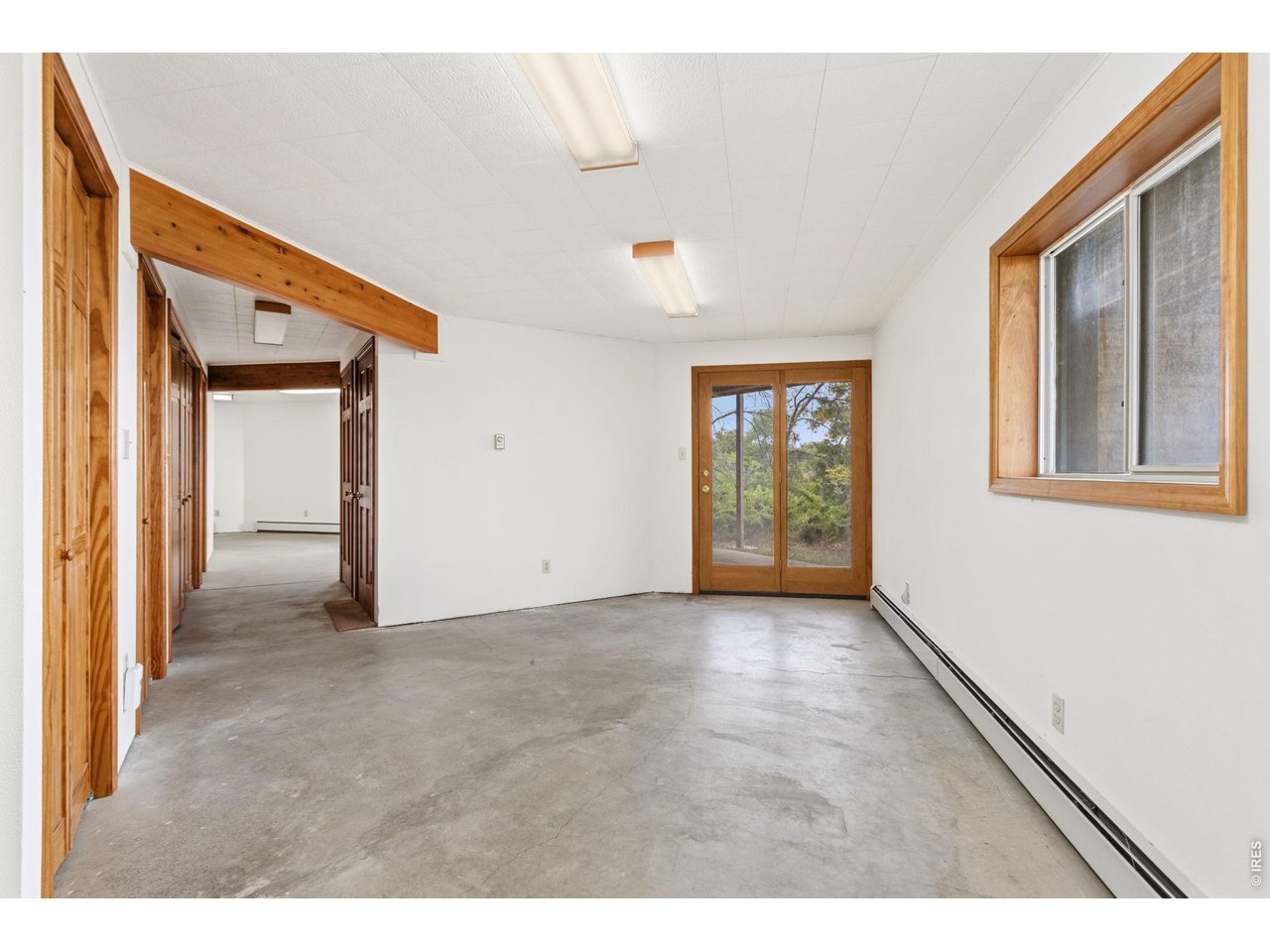 Property Photo 32 Lower level walk-out basement features 2 large living areas, en suite bedroom, mechanical room and storage