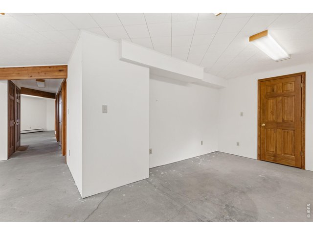 Property Photo 33 Basement west living space with storage closet