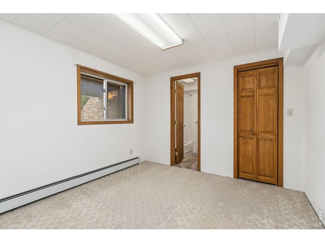 Property Photo 35 Basement East living space and leads to the 3rd bedroom with its own full bath