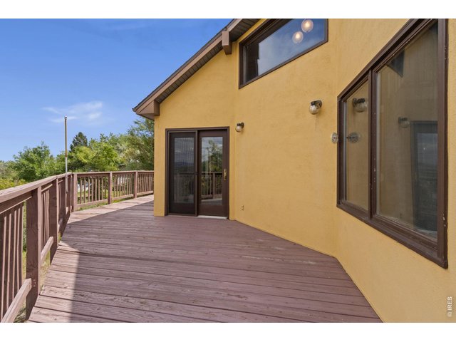 Property Photo 39 Patio door from the Dining Room leads to this wrap-around deck!