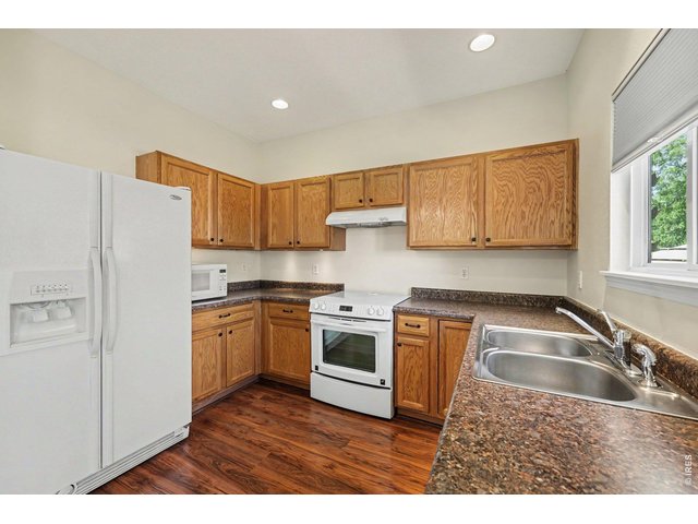 Property Photo 7 Kitchen is open with lots of cabinet space!