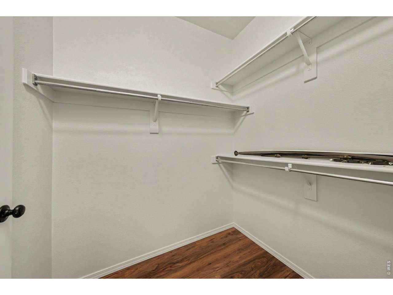 Property Photo 15 Walk-in closet in primary bedroom has lots of closet space