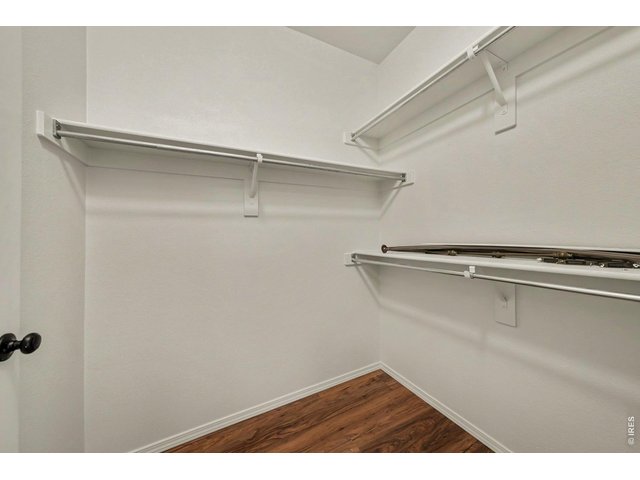 Property Photo 15 Walk-in closet in primary bedroom has lots of closet space
