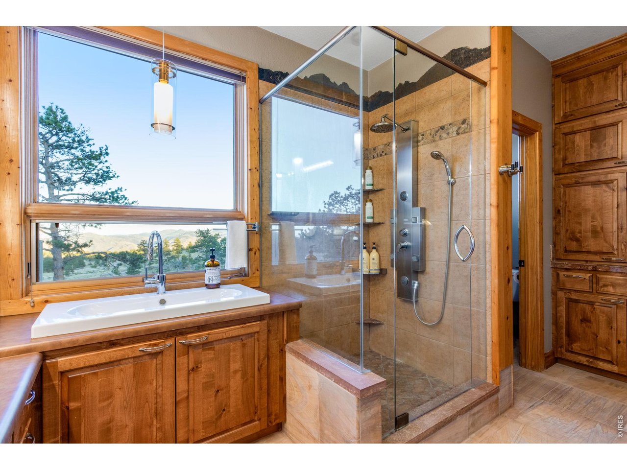 Property Photo 30 and a spacious walk-in closet with plenty of cabinets, organizers and a full body mirror