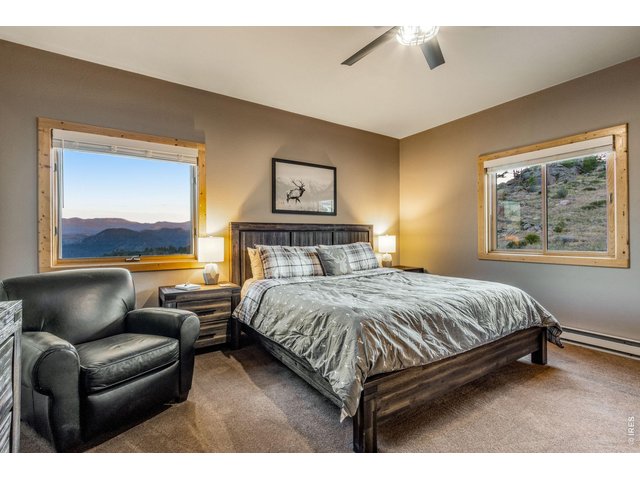 Property Photo 34 Guest bed 2 with retreat, views, ceiling fan, attached shelving and attic access