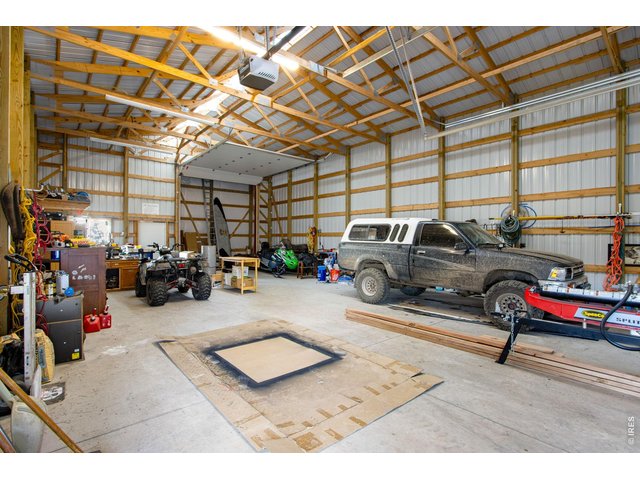 Property Photo 47 The detached RV/Boat Garage is massive. It features 12' and 14' doors. The largest bay is ready to be adapted to become a pull-through bay.