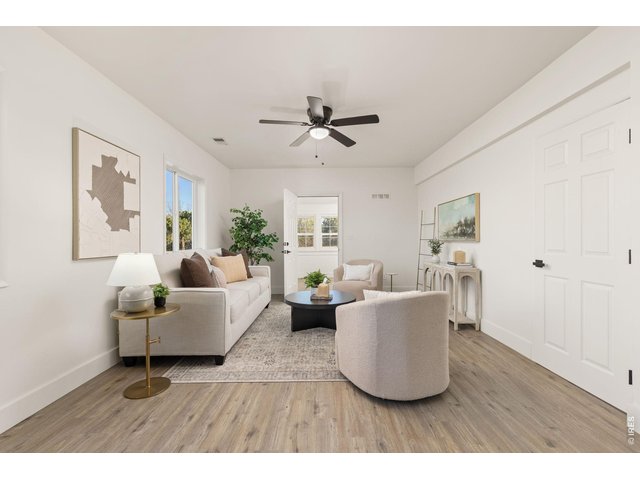 Property Photo 7 Bright and inviting main-level living space showcasing the farmhouse's thoughtfully updated interior.