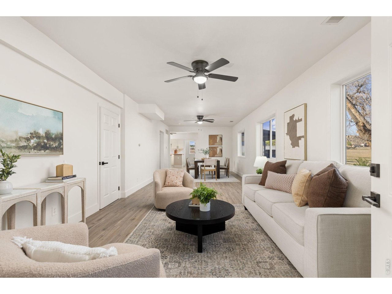 Property Photo 8 Open living and dining areas create a comfortable flow through the remodeled farmhouse.