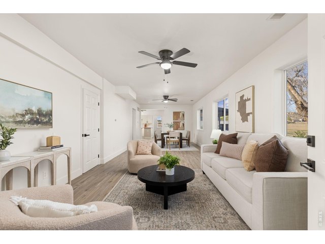Property Photo 8 Open living and dining areas create a comfortable flow through the remodeled farmhouse.