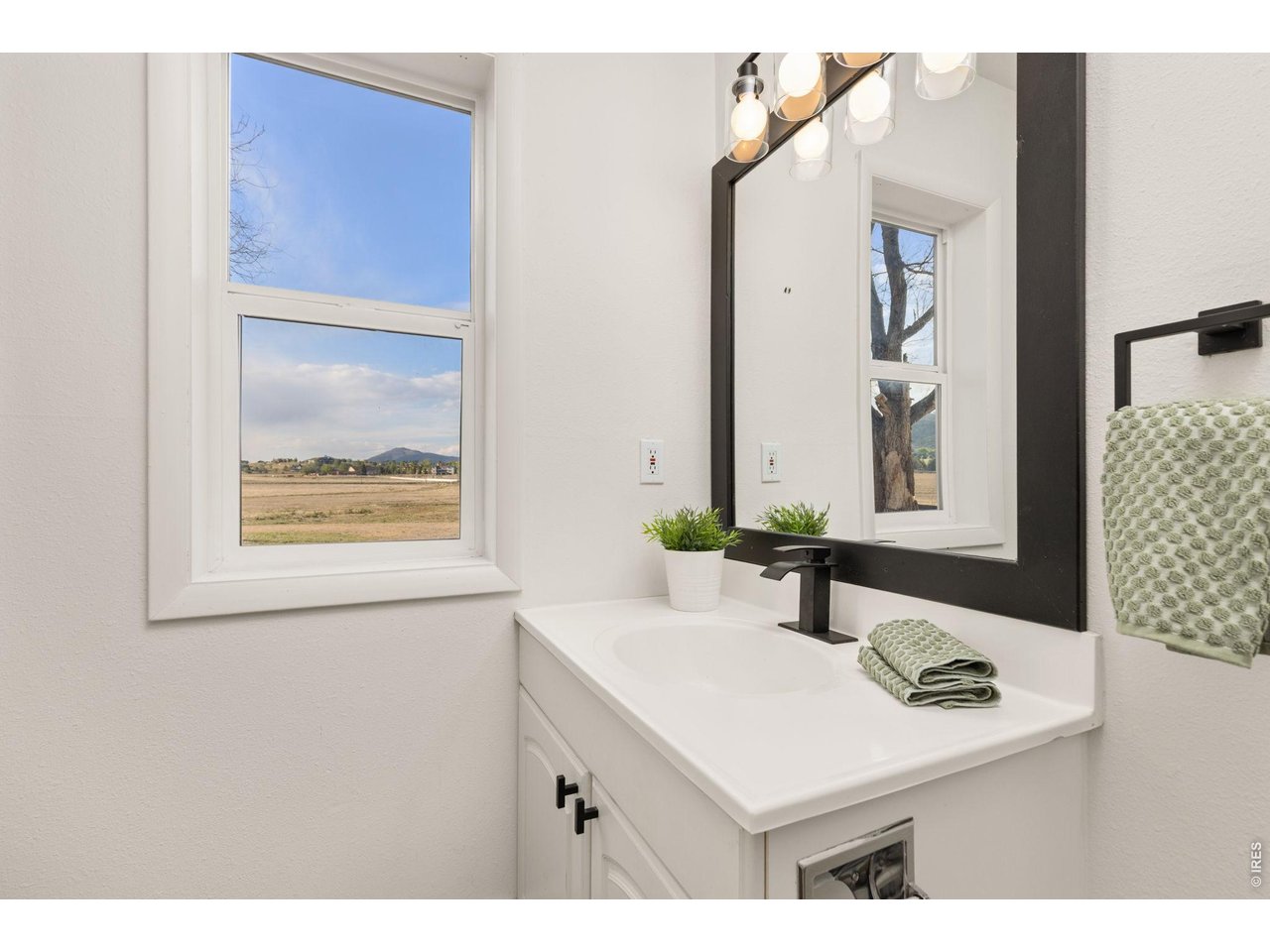 Property Photo 17 Another view of the updated main-level full bath with views across the surrounding acreage.