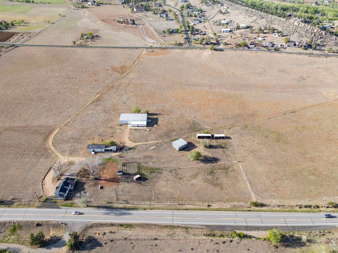 Property Photo 4 Aerial view highlighting the property's improvements and direct access from West US Highway 34.