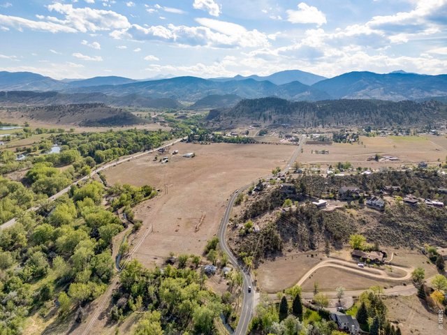 Property Photo 1 Rare 67-acre West Loveland offering at the gateway to the foothills, combining acreage, water rights, two residences, multiple outbuildings and exceptional access.
