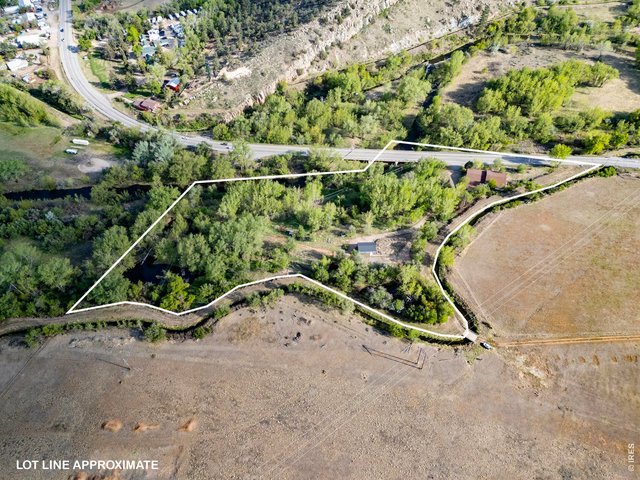 Property Photo 23 Aerial view of the river portion of the property, with approximate property lines shown for reference.