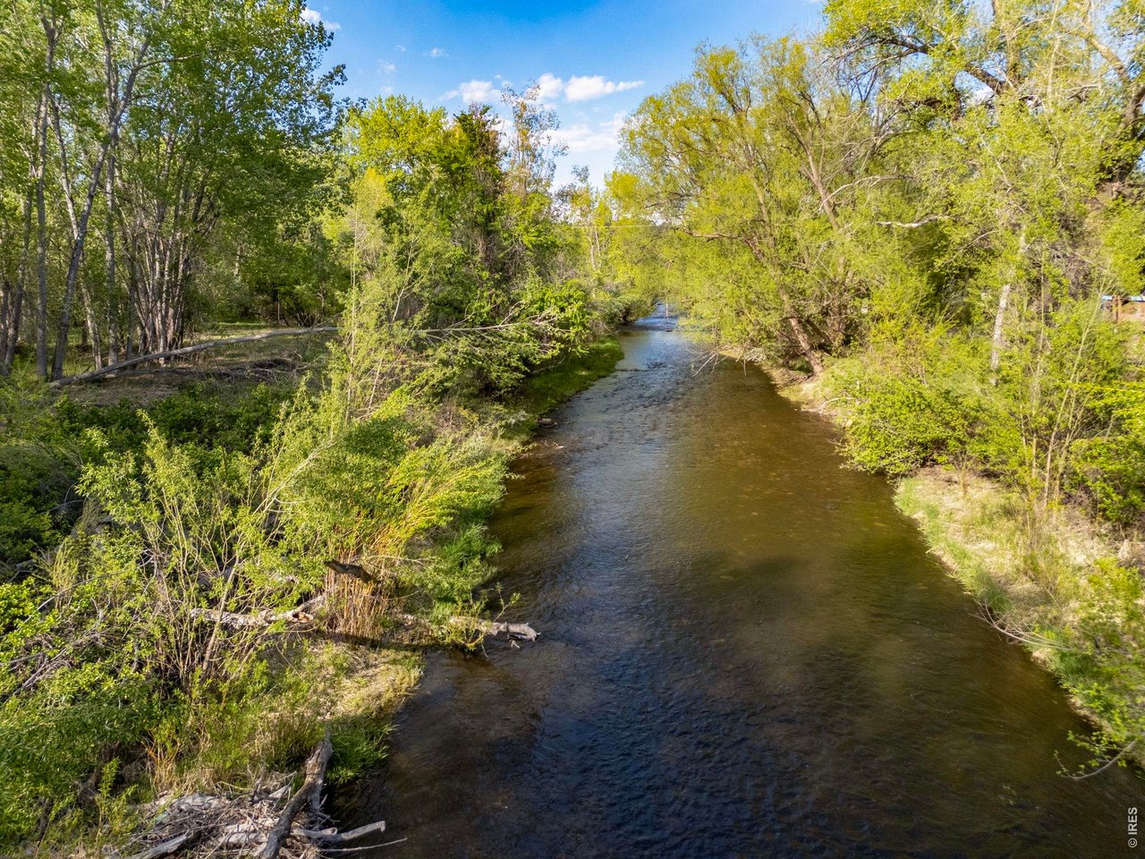 Property Photo 25 Another view of the Big Thompson River as it winds through the wooded eastern portion of the property.